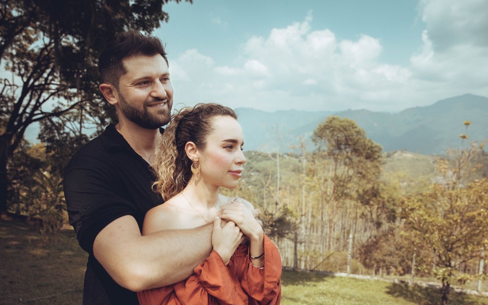 Leidy Munera with her partner Remi looking out over the mountains